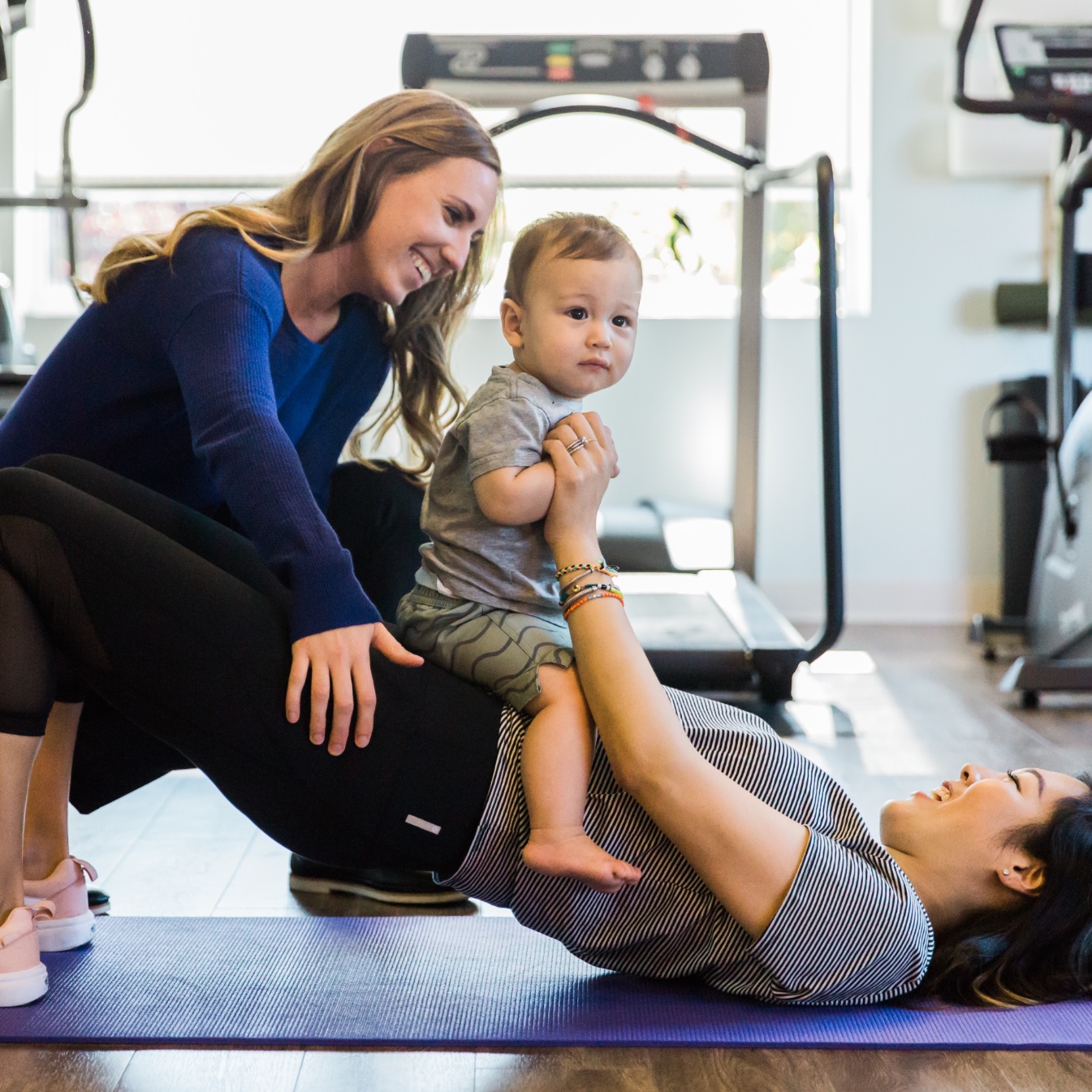 Practitioner works with a patient and her baby