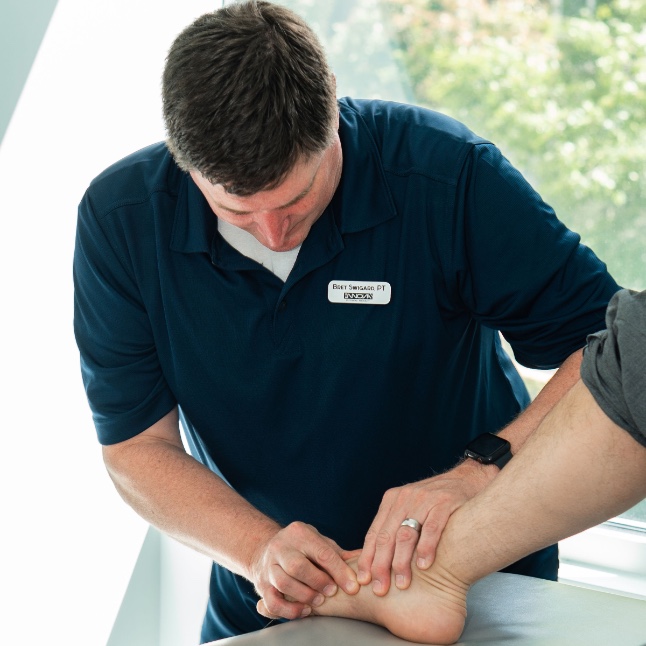 Bret manipulates a foot for chiropractic treatment